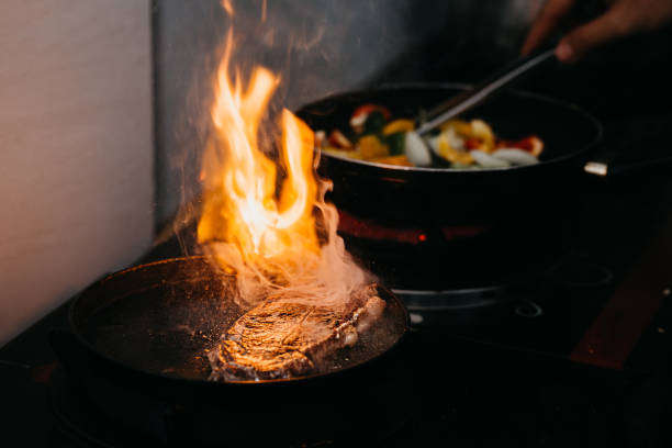 istock Chef cooking beef steak in the kitchen 1391450758
