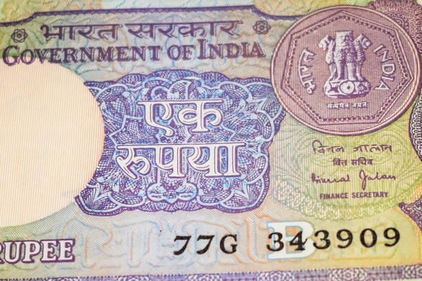 istock Old One Rupee notes combined on the table, India money on the rotating table. Old Indian Currency notes on a rotating table, Indian Currency on the table 1391451891