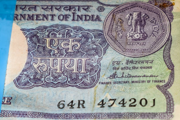 istock Old One Rupee notes combined on the table, India money on the rotating table. Old Indian Currency notes on a rotating table, Indian Currency on the table 1391451917