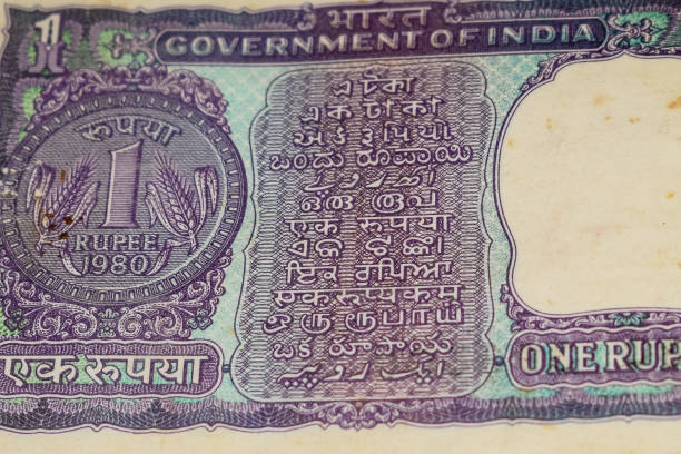 istock Old One Rupee notes combined on the table, India money on the rotating table. Old Indian Currency notes on a rotating table, Indian Currency on the table 1391451919