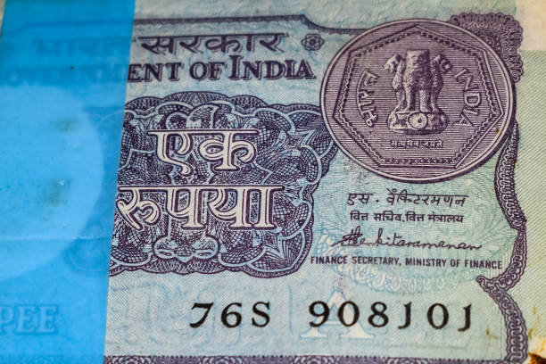 istock Old One Rupee notes combined on the table, India money on the rotating table. Old Indian Currency notes on a rotating table, Indian Currency on the table 1391451921