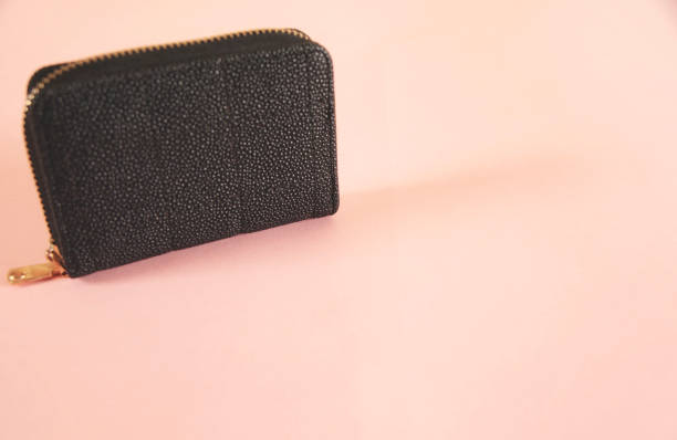 istock woman   wallet on the pink  table 1391452046