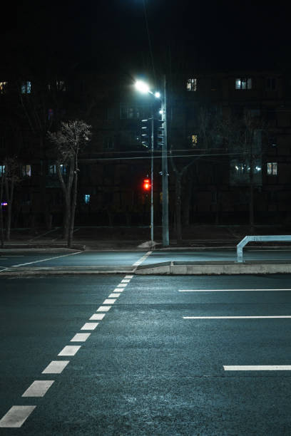 istock A crosswalk with a prohibitive traffic light signal at night. 1391454315