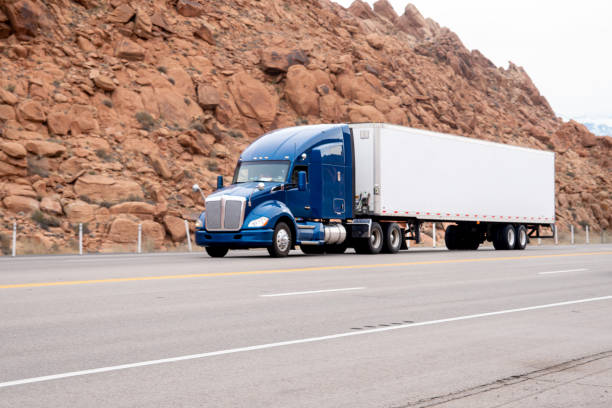 istock Semi Trucks on a Four Lane Highway near Moab Utah 1391454884