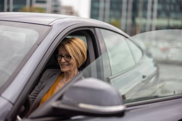 istock Female driver sitting in car 1391456035