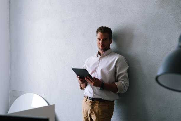 istock Portrait Of Businessman Using Tablet 1391456775