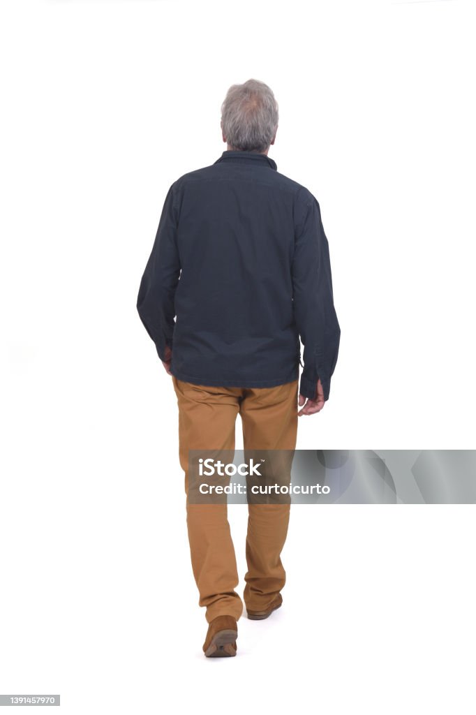 man isolated on white background rear view of a man walking on white background on white background Rear View Stock Photo