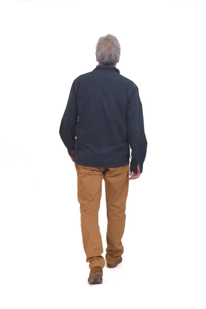 man isolated on white background rear view of a man walking on white background on white background rear view stock pictures, royalty-free photos & images