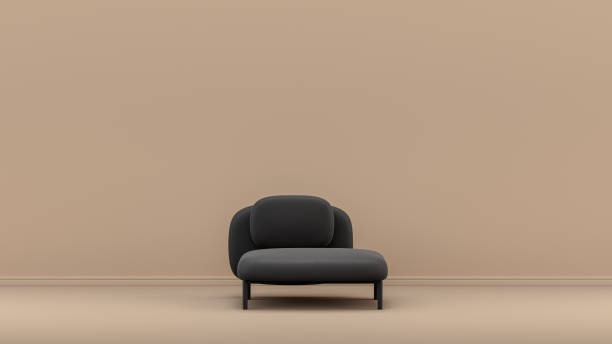 istock Black color armchair in front of light brown empty wall 1391458406