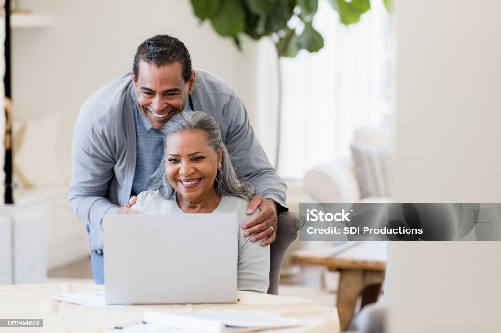 Grandparents have a video call Grandparents are excited to have a video call with their grandparents. Couple - Relationship Stock Photo