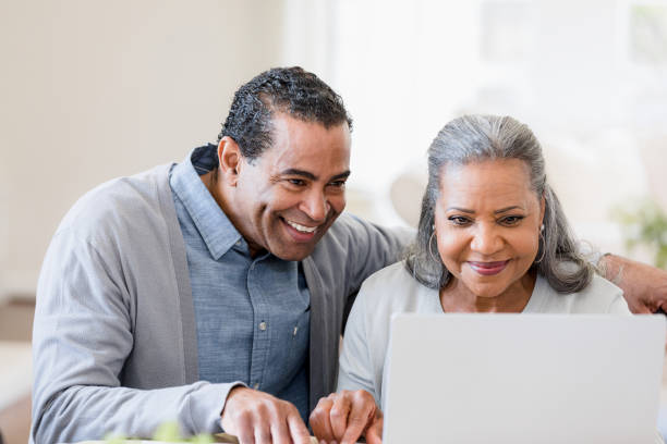 istock Senior couple reviews paperwork sent over 1391464018