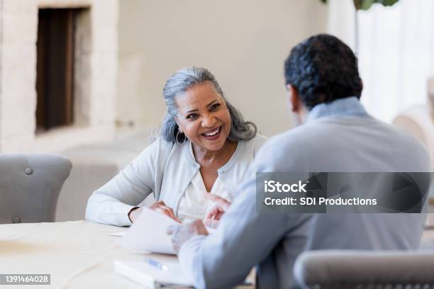 Senior woman meets with financial advisor