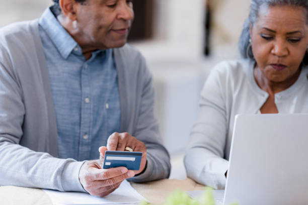 istock Husband helps verify credit card information 1391464038