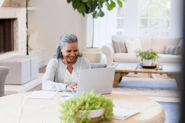 istock Elderly woman types up email 1391464146