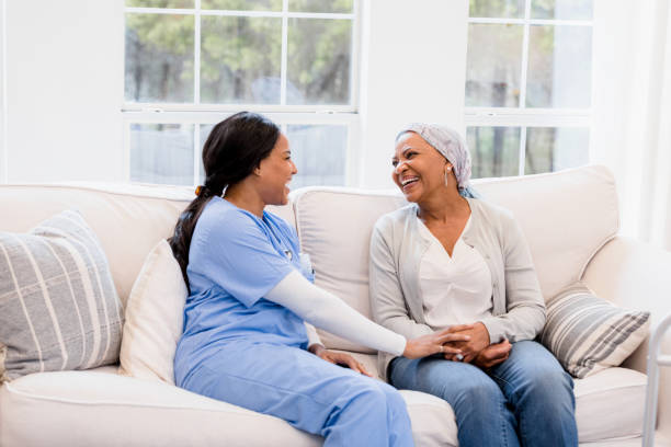 istock Hospice nurse sits with her cancer patient 1391464160