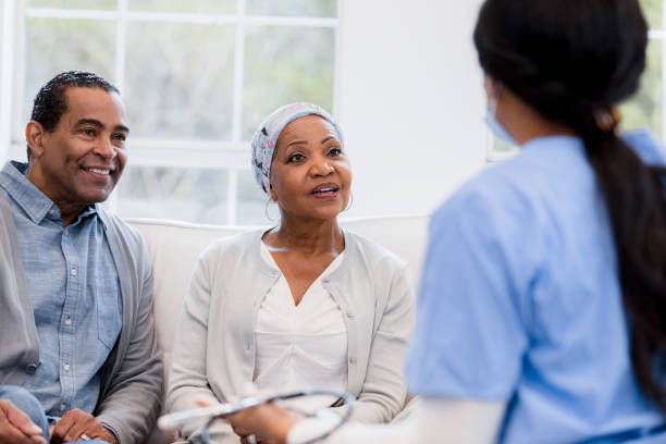 istock Elderly couple sit with nurse to talk about lab results 1391464176