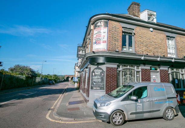 The Steam Packet Pub at Strood of Rochester in Kent, England The Steam Packet Pub at Strood of Rochester in Kent, England, with a company car outside in the street and commercial signs visible. rochester restaurants stock pictures, royalty-free photos & images