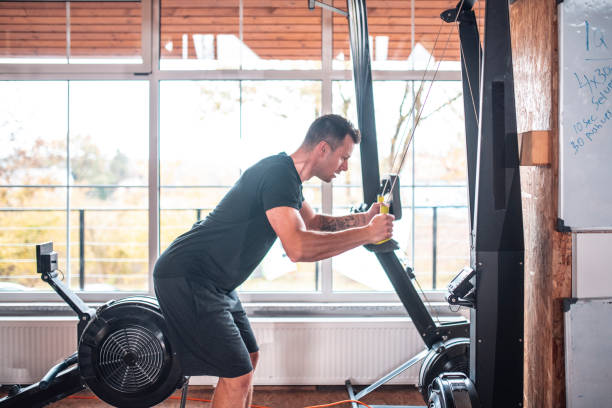 istock Confident male athlete pulling equipment at gym 1391465426