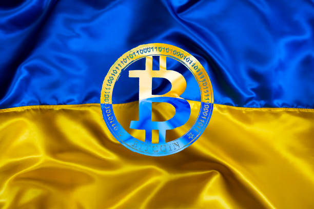 istock Bitcoin sign on Ukrainian national flag background 1391469253