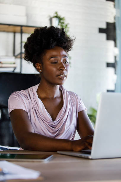 istock Diligent businesswoman typing data on laptop at her desk 1391469420