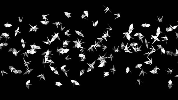 istock White origami crane on black background. 1391469690