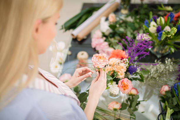 istock Woman making floral decorations 1391469789