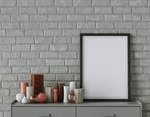 istock Single picture frame on an interior room console table with decorative accessories on it, 3d Rendering 1391471131