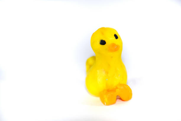 istock Plasticine yellow duckling. platinum toys on white background. 1391472901