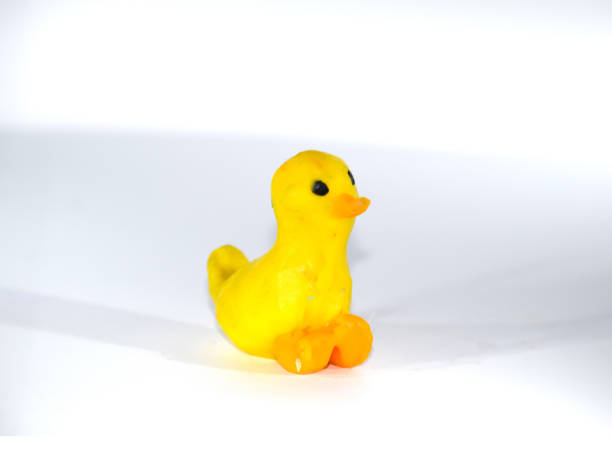 istock Plasticine yellow duckling. platinum toys on white background. 1391472905