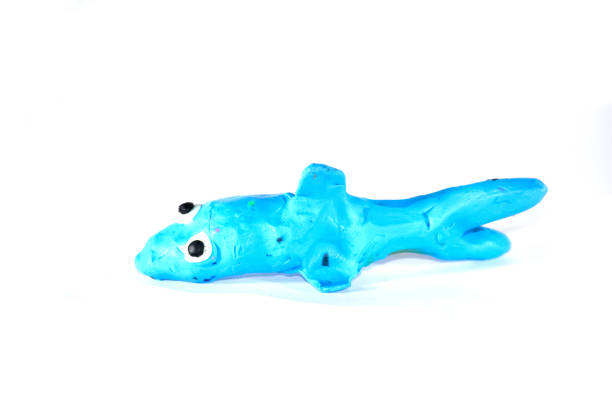 istock Plasticine shark. Plasticine toys on white background 1391472914