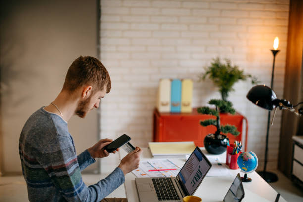 istock Single person shopping at home using credit card 1391472918