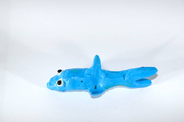 Plasticine shark. Plasticine toys on a white background