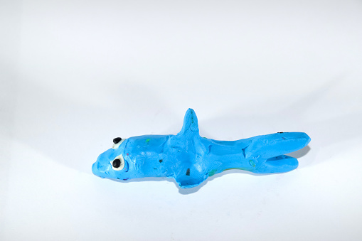 Plasticine shark. Plasticine toys on a white background
