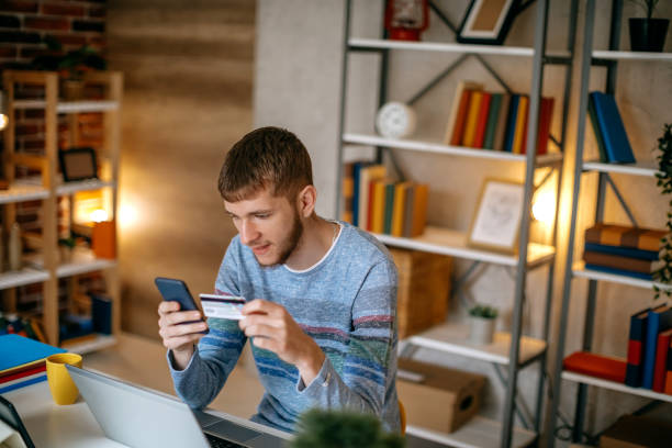 istock Single person shopping at home using credit card 1391472953