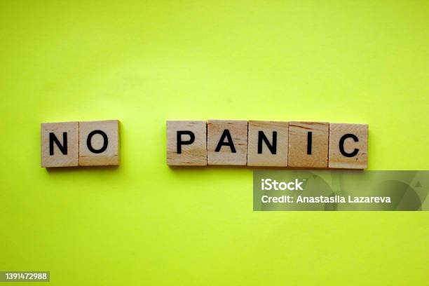 Word No Panic On A Yellow Background The Inscription Is Made Of Wooden Cubes Danger Panic A Call To Remain Calm Copy Space Top View Flat Lay Stock Photo - Download Image Now