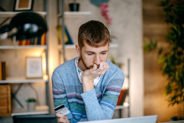 istock Single person shopping at home using credit card 1391473073