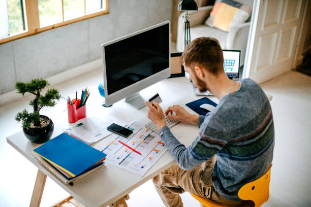 istock Single person shopping at home using credit card 1391473156