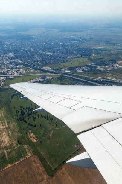 istock View through the porthole on an aircraft wing 1391474499