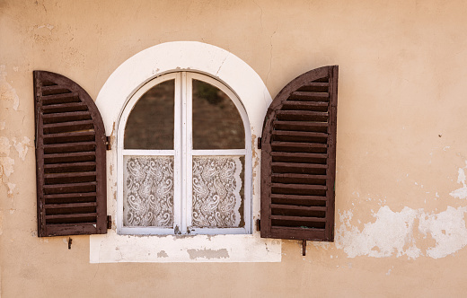 a close up of a window to rustic building