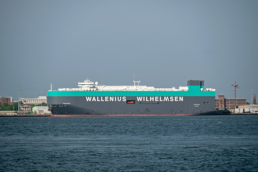 Charleston, SC, USA - April 15, 2022: Thalatta, a 200-meter vehicles carrier owned by Wallenius Wilhelmsen Logistics and flagged to Malta, moored at Columbus Street Terminal in Charleston Harbor.