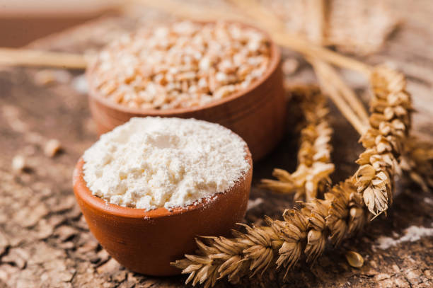istock Fresh wheat grains and flour. 1391475571