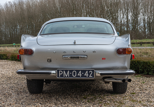 rear view of a beautiful old classic car, lights, bumper, chrome.