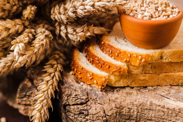 istock Bread isolated on wooden background. 1391478002