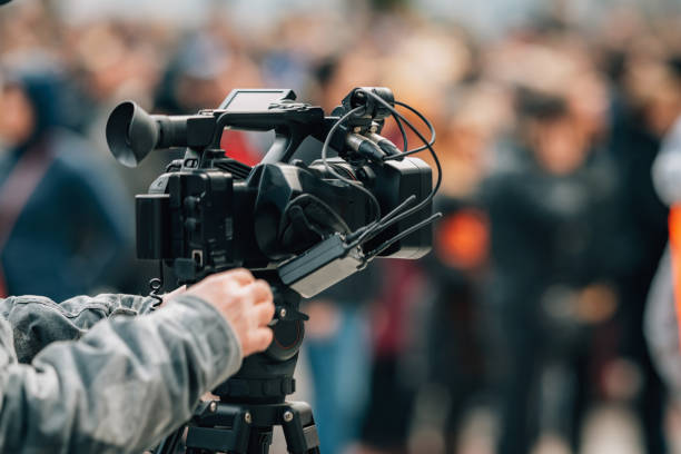 istock News crew reporting from the streets during public protests 1391478841