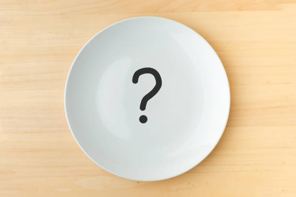 istock Empty white plate on wooden table. background for restaurant menu 1391480497