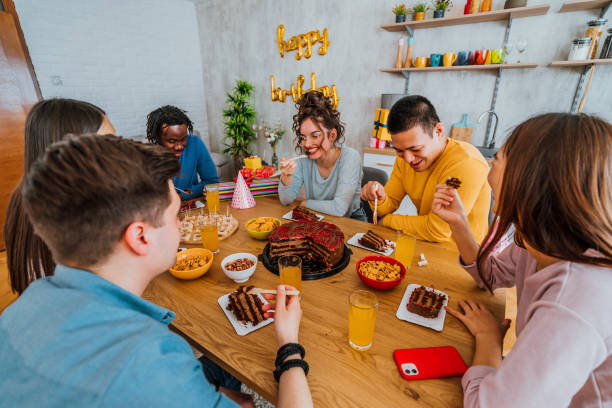 istock Multi-ethnic friends enjoying home birthday party 1391481303