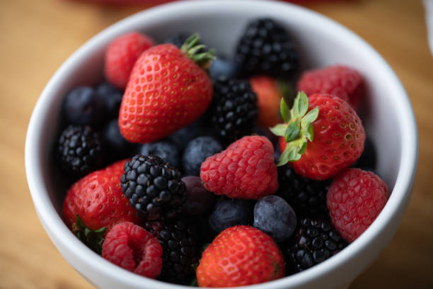 istock berries in white bowl, strawberry, blackberry, raspberry 1391481447
