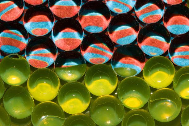istock abstract futuristic background with colorful beads and different reflections and fluorescent green, creative art design, half half wallpaper, modern composition 1391483530