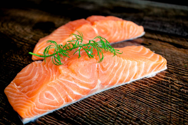 istock Raw Salmon Fillets Garnished with Fresh Dill 1391494346