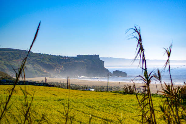 istock Praia do Norte looking to the Fort 1391495538